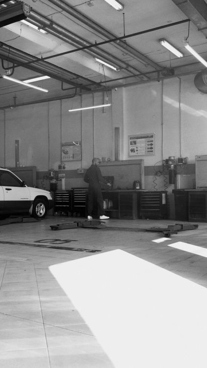 Mechanic in sunlit workshop
