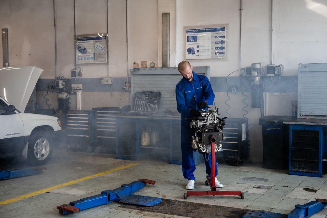 Mechanic inspecting engine